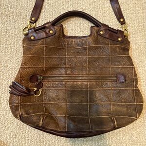 Brown leather crossbody bag with a zipper in great condition.